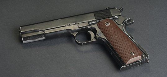 Gun with brown handle