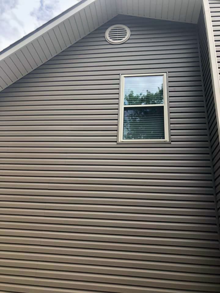 A house with a window on the side of it.