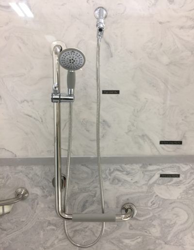 A shower head with a handle attached to it
