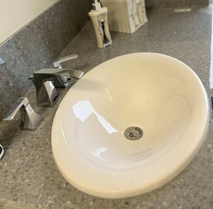 A bathroom sink with a hole in the middle of it.