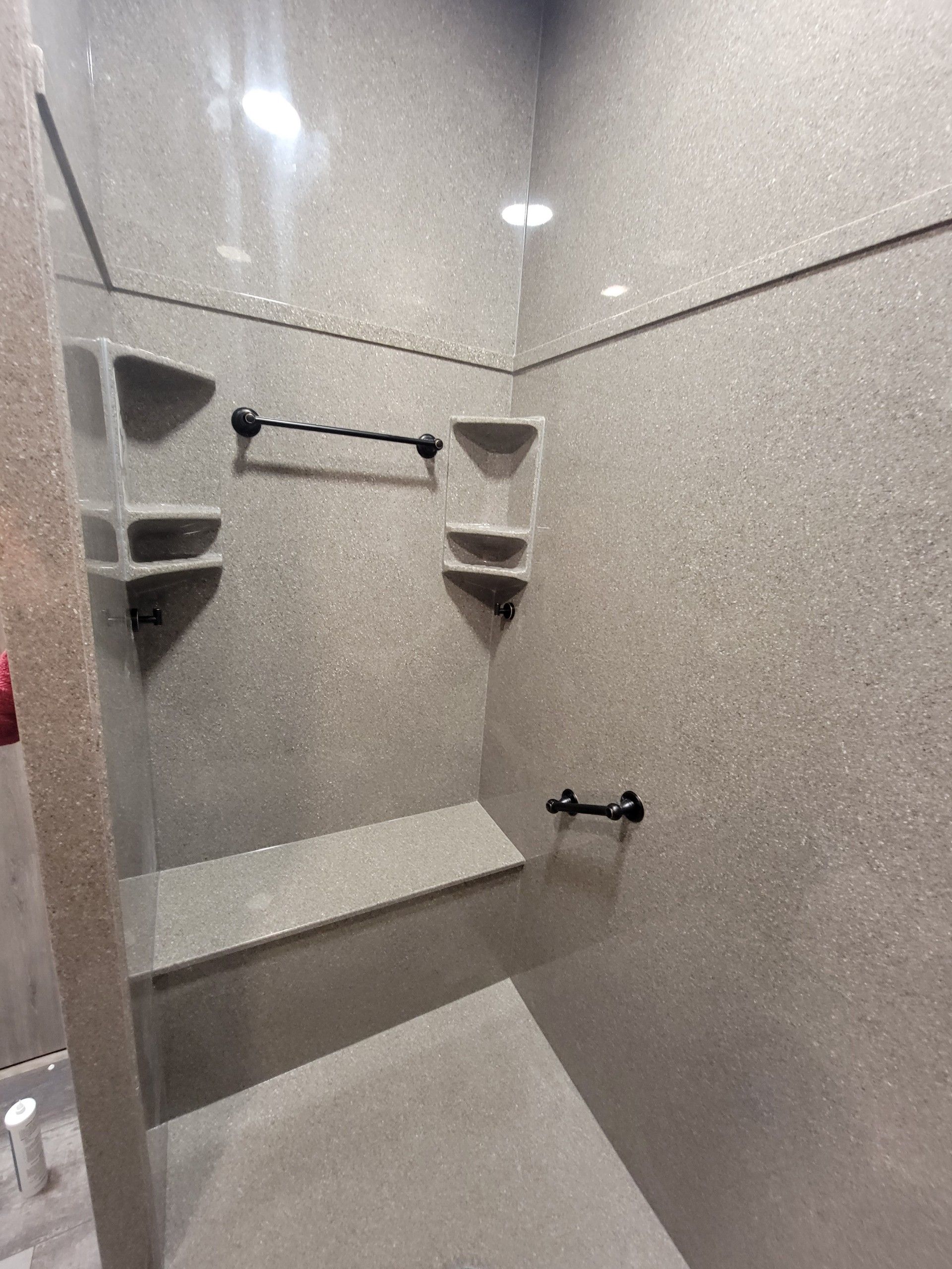 A bathroom with a walk in shower and a bathtub.