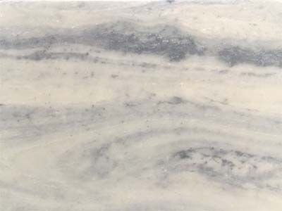 A close up of a white and gray marble counter top.