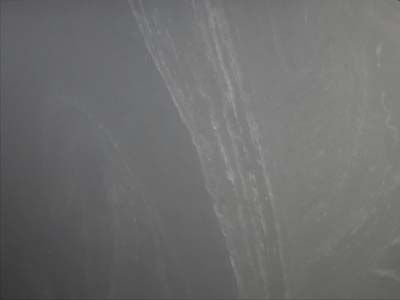 A close up of a gray surface with a few lines on it.