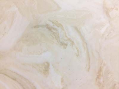 A close up of a tile with a marble texture.