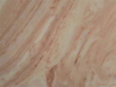 A close up of a tile with a marble texture.