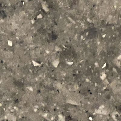 A close up of a granite counter top with a lot of small stones on it.