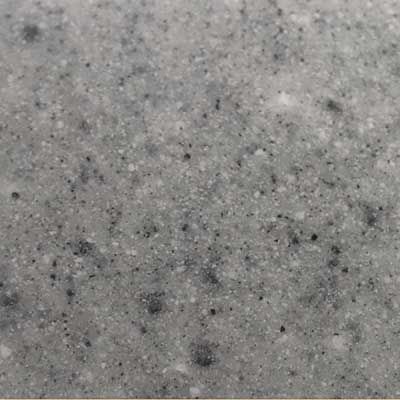 A close up of a gray granite counter top.