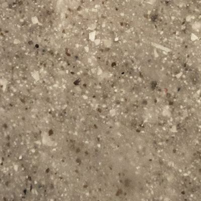 A close up of a brown and white granite counter top.