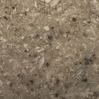 A close up of a granite counter top with a lot of small stones on it.