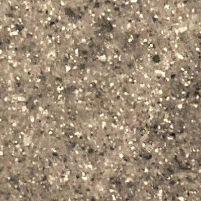 A close up of a granite counter top with a lot of small stones on it.