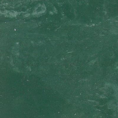 A close up of a green chalkboard texture.