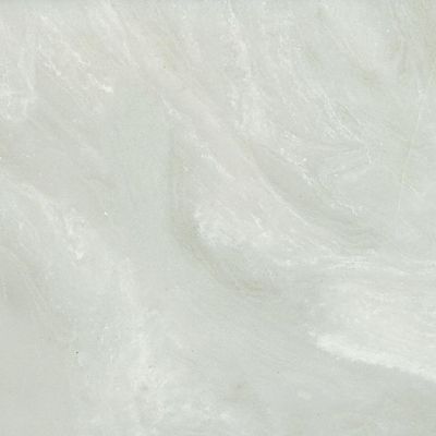 A close up of a white tile with a marble texture.