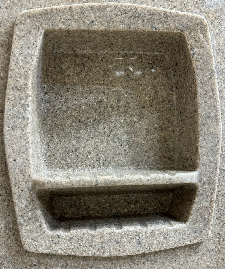 A bathroom with a walk in shower and a sink