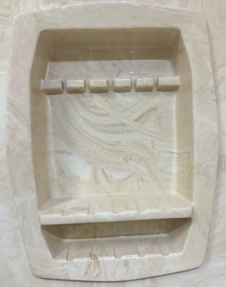 A bathroom with a walk in shower and a towel hanging on the wall.