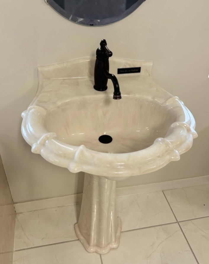 A bathroom sink is sitting on top of a counter.