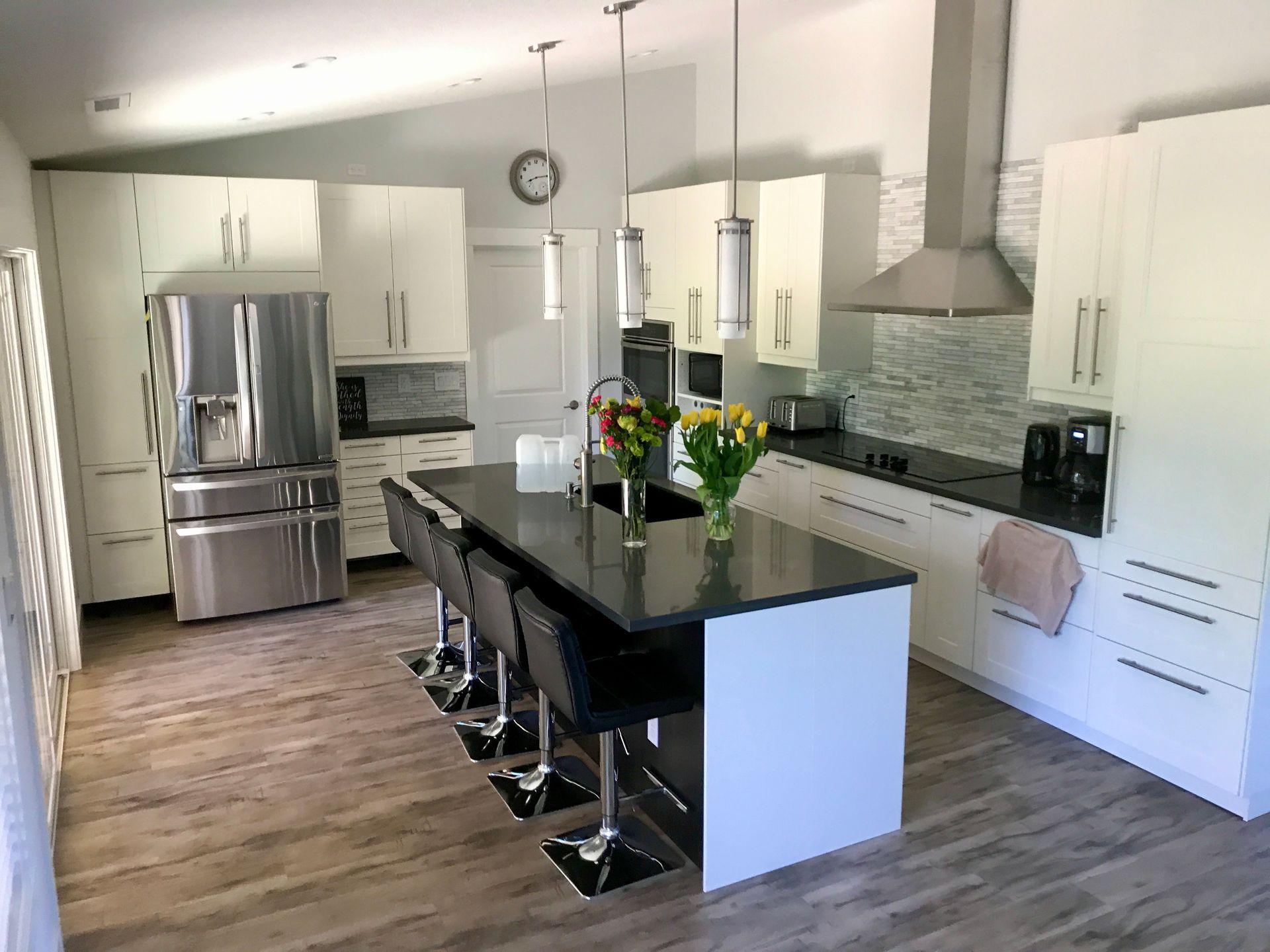 There is a large island in the middle of the kitchen.