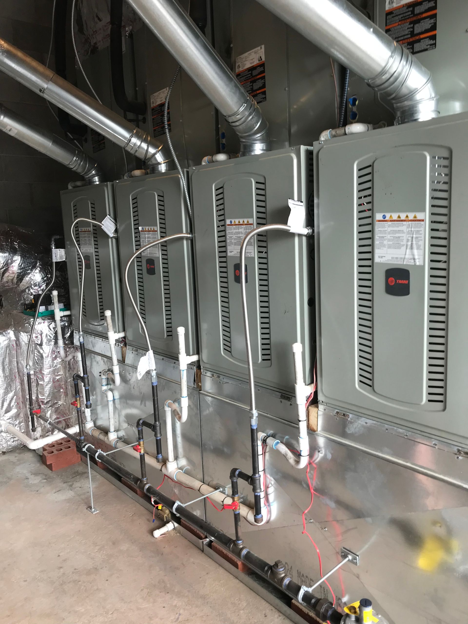 Back side of four ac cooling and heating systems