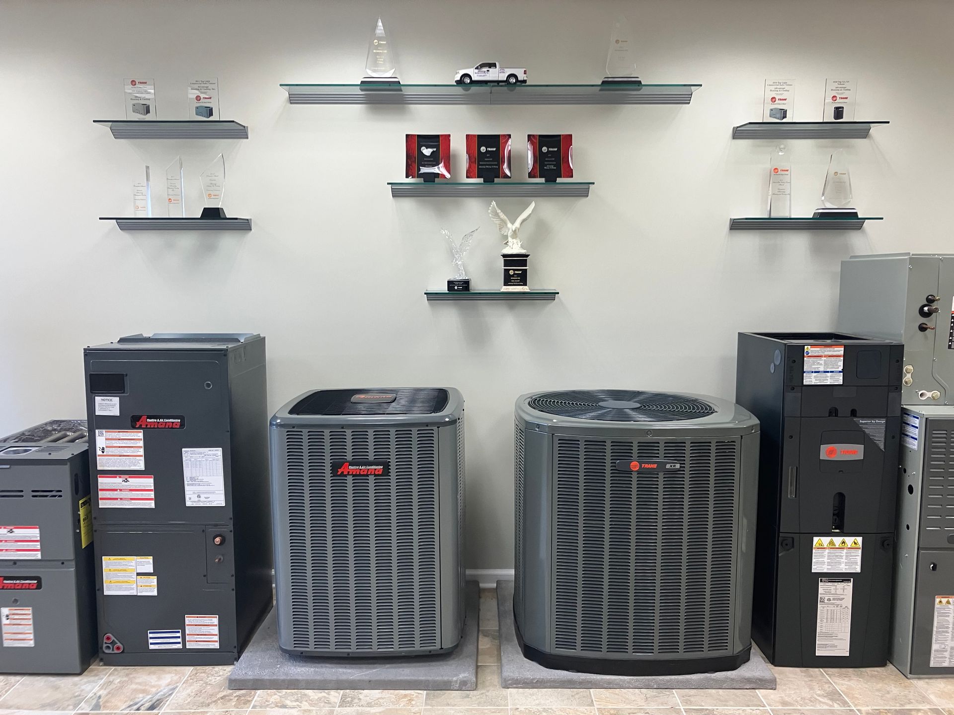 There are many different types of air conditioners on display in this room.