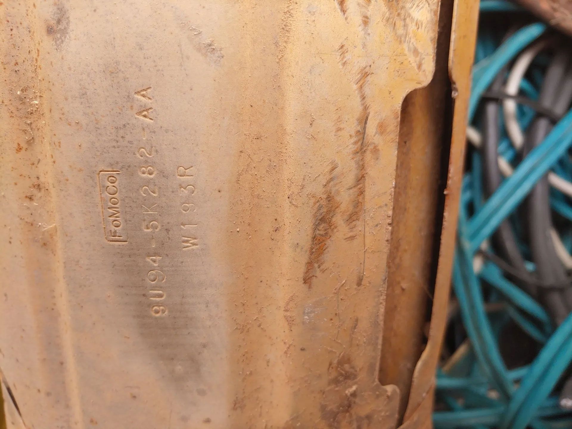 Close-up of a part with stamped numbers 