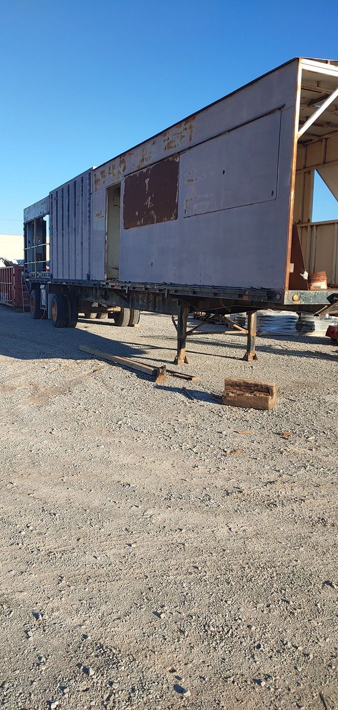 A large, open-sided trailer