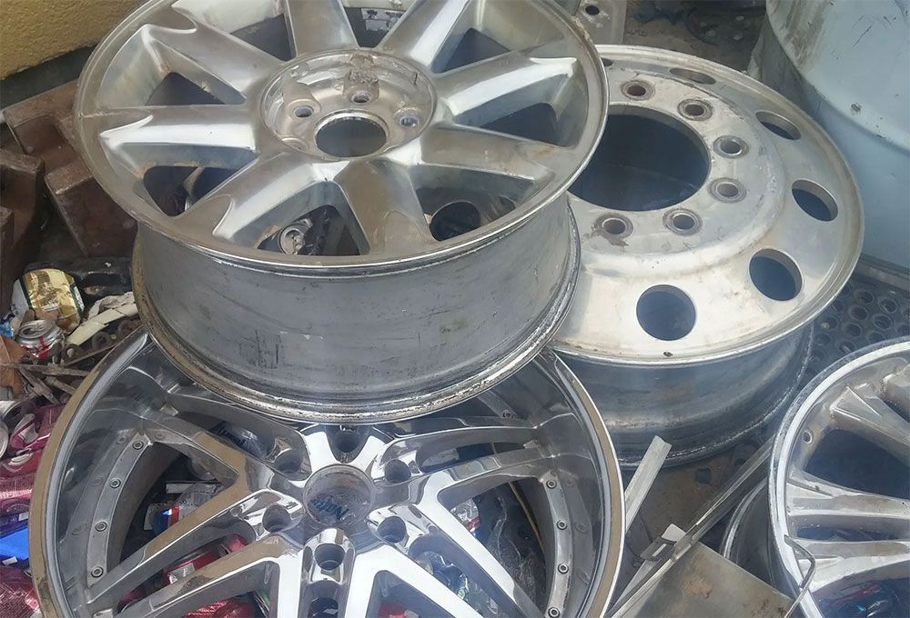 Silver alloy car wheels piled together