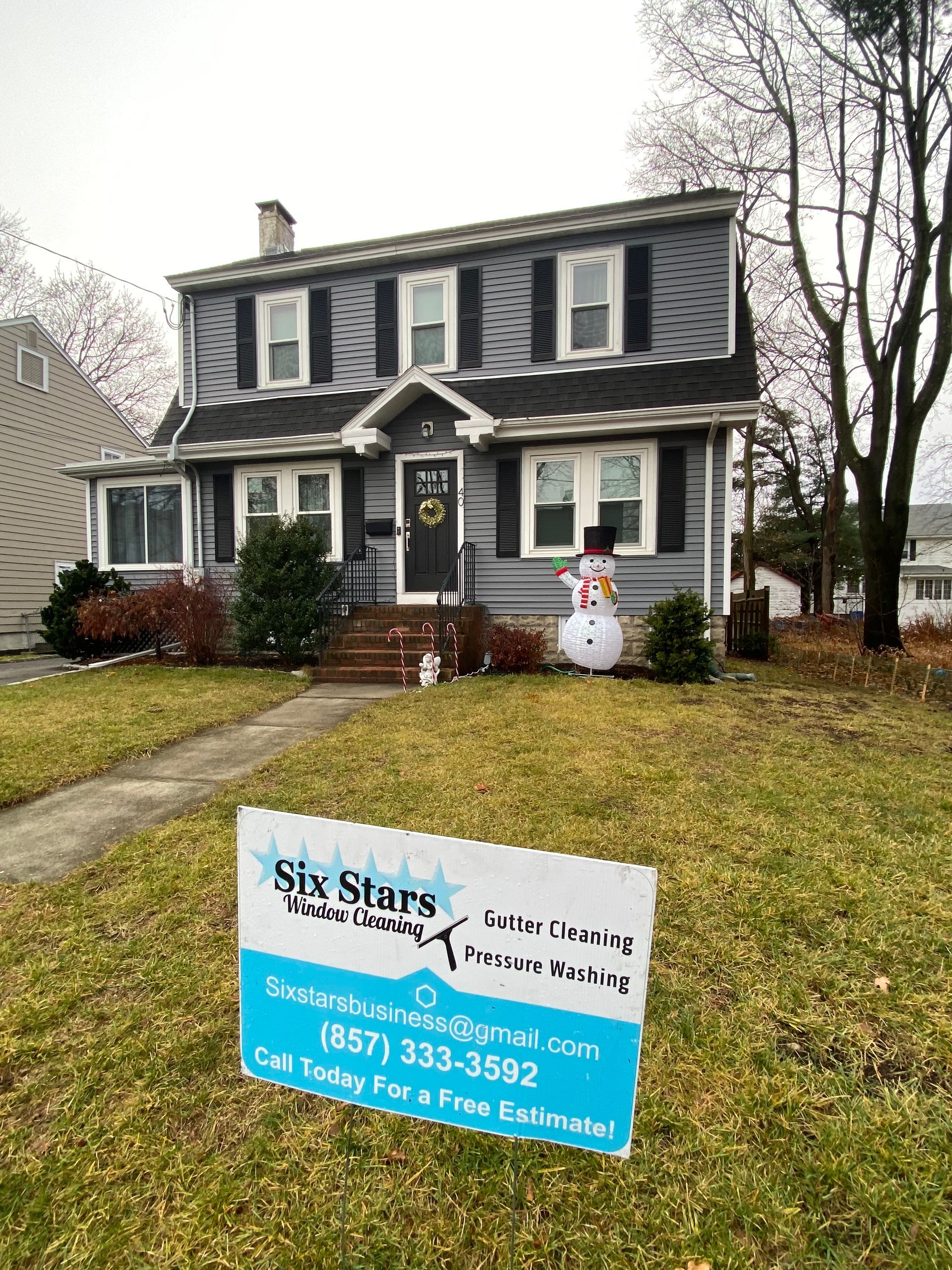 A house with a sign in front of it that says six stars.