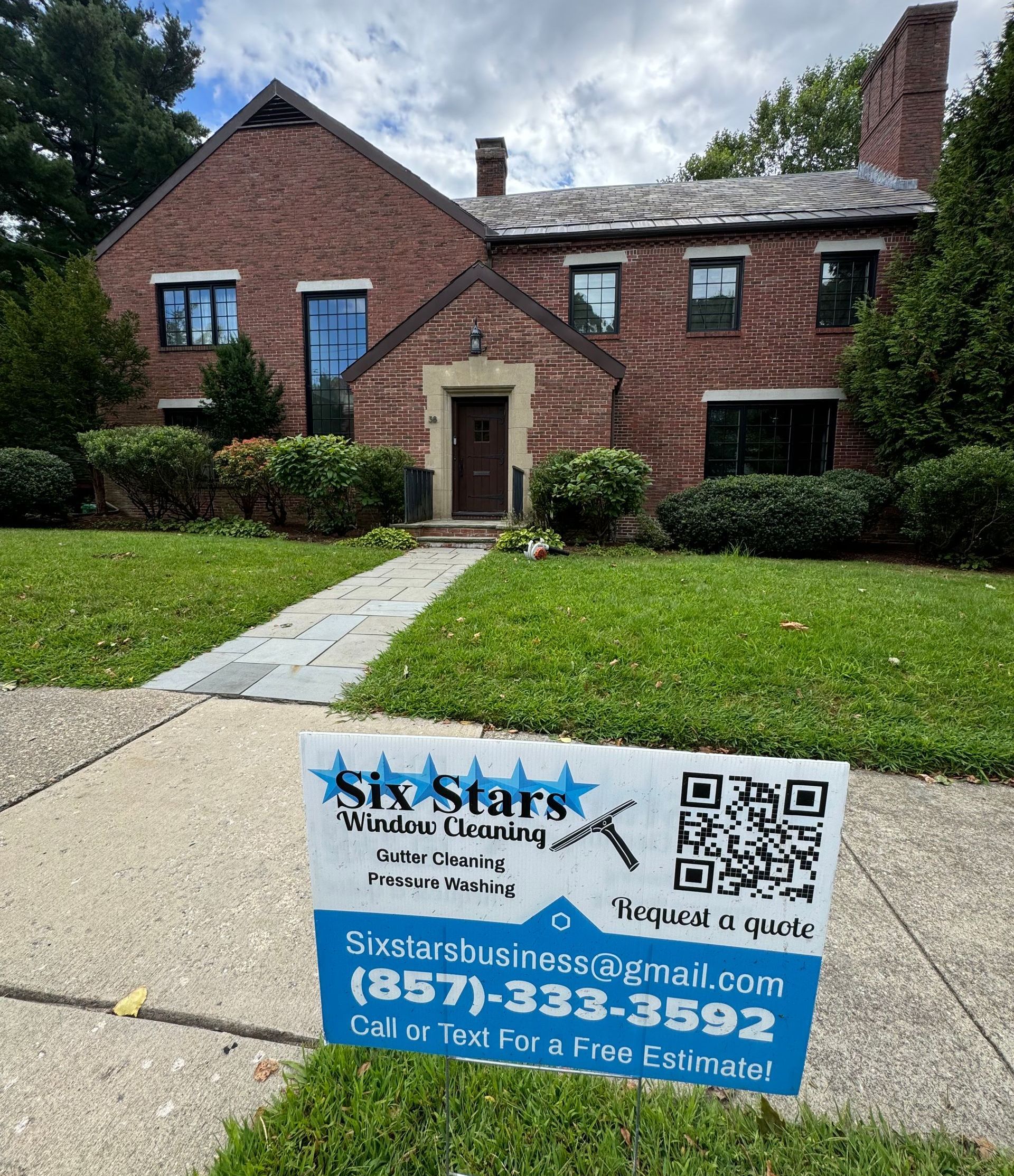 A large window with a view of a deck and trees.