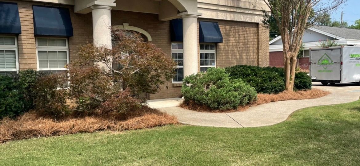 White van is parked in front of a brick house