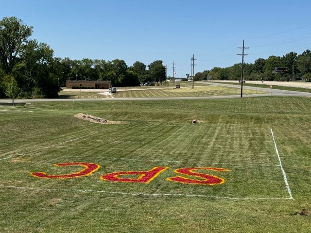 A field with the word spc painted on it