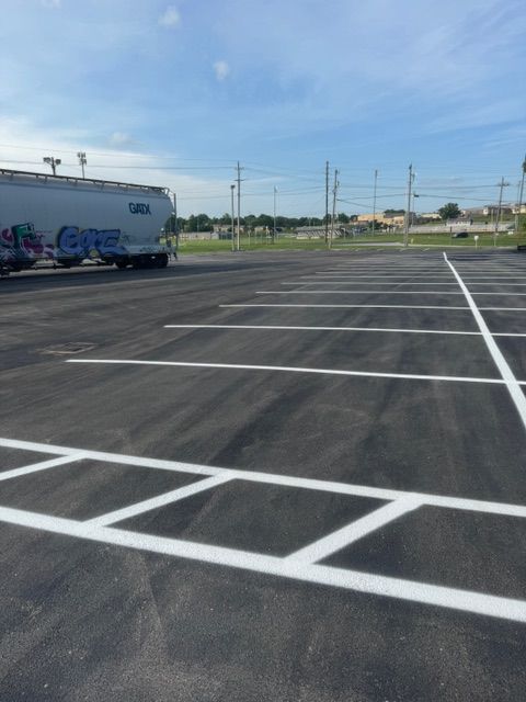 A parking lot with white lines and a truck that says cargo
