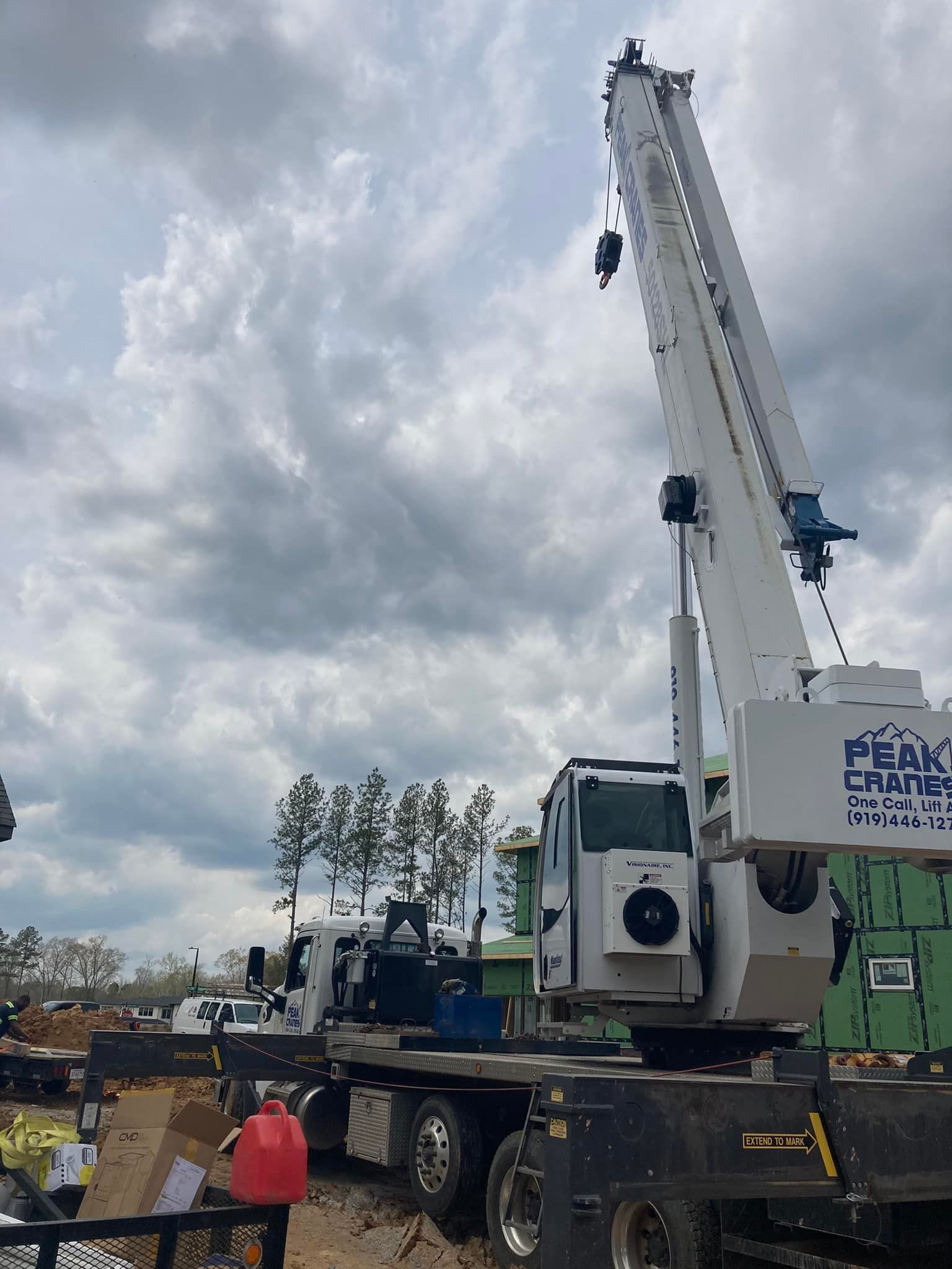 A large crane is sitting on top of a truck