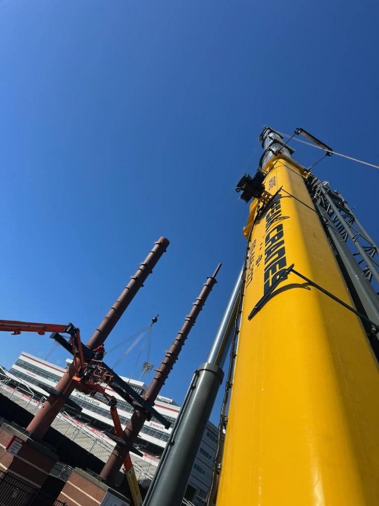 A large yellow crane with the word liebherr on it