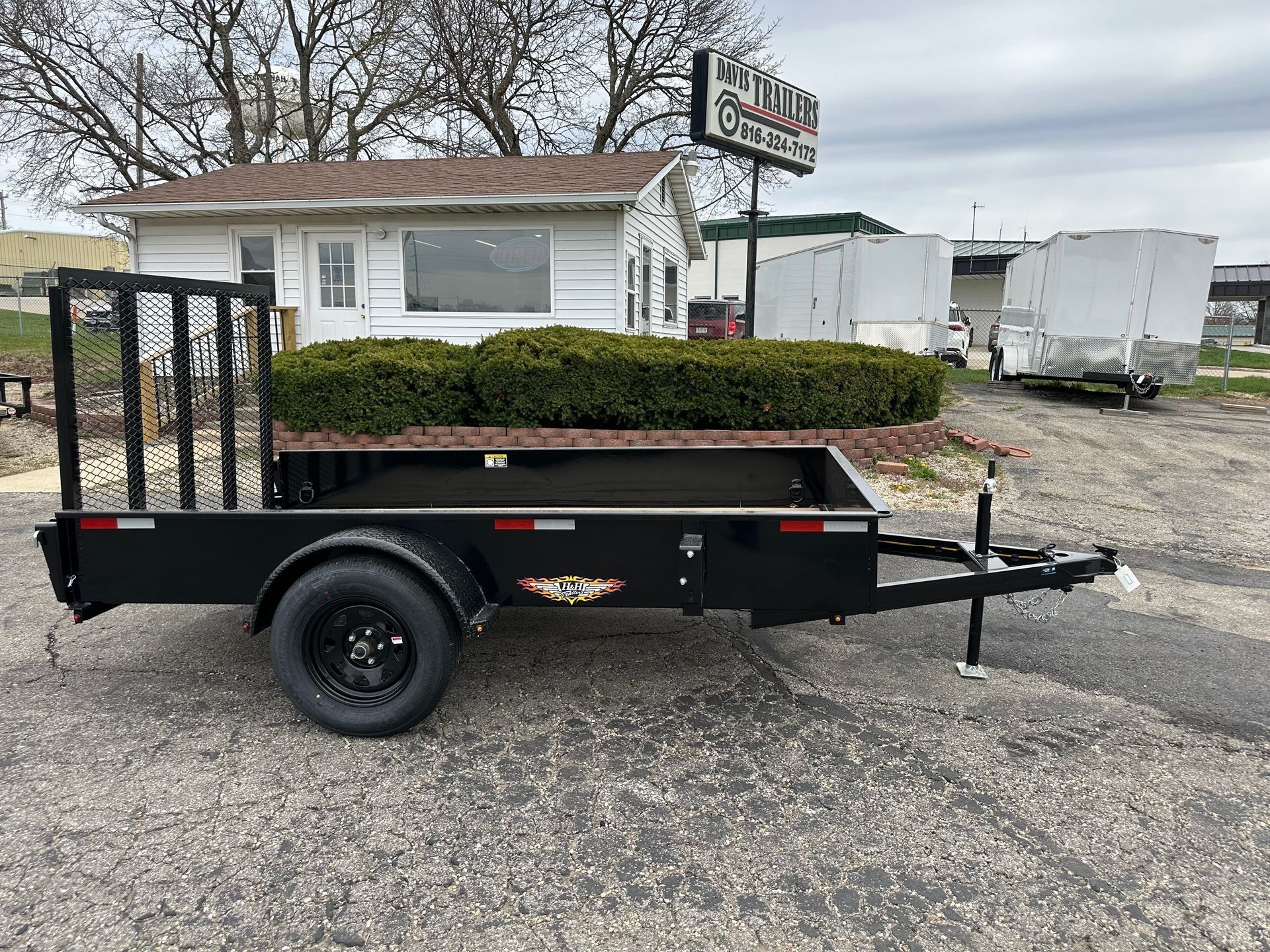 White enclosed cargo trailer on a paved surface