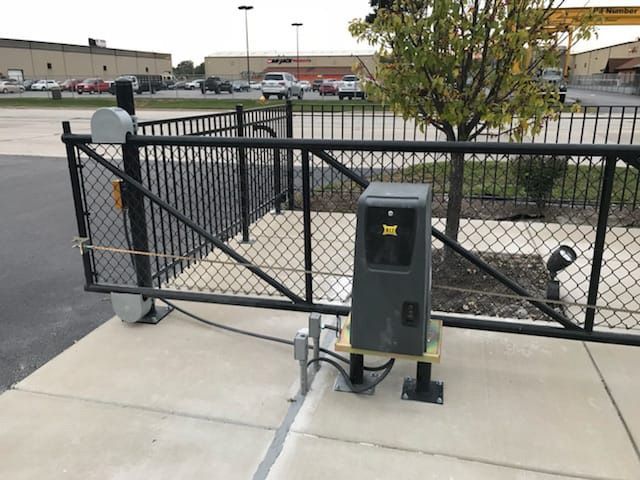 A black gate with a yellow x on it