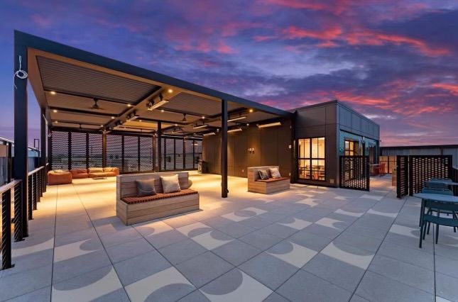 An artist 's impression of a rooftop terrace at sunset