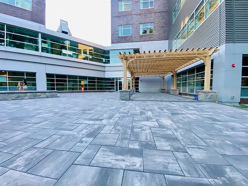 A large building with a large patio in front of it.
