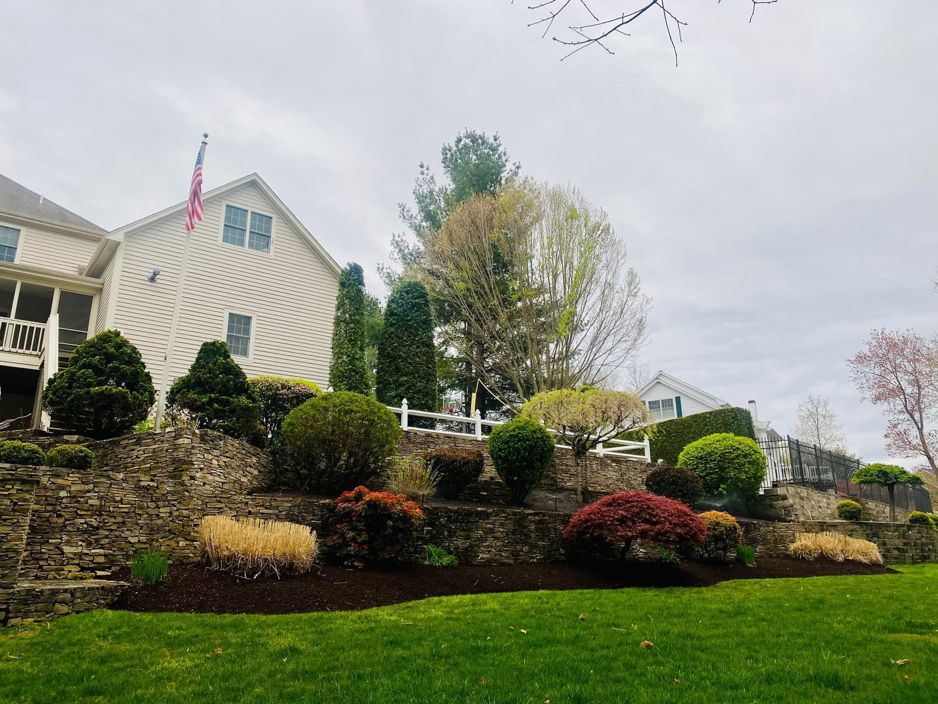 A large house with a large lawn in front of it.