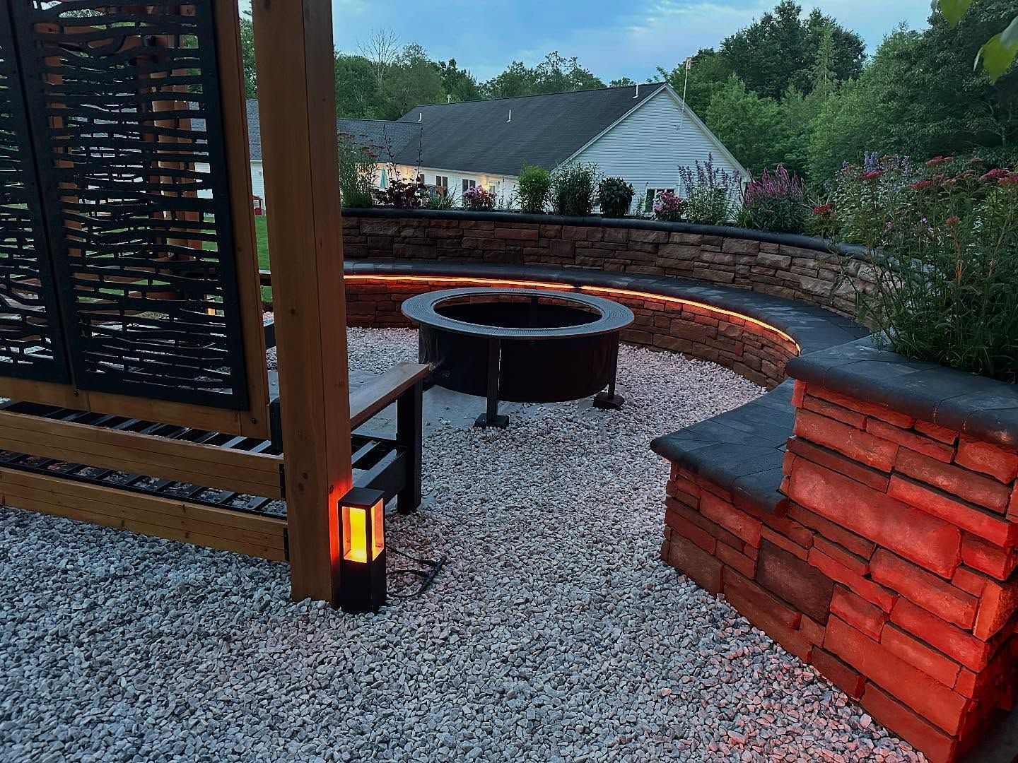 There is a fire pit in the middle of the patio.