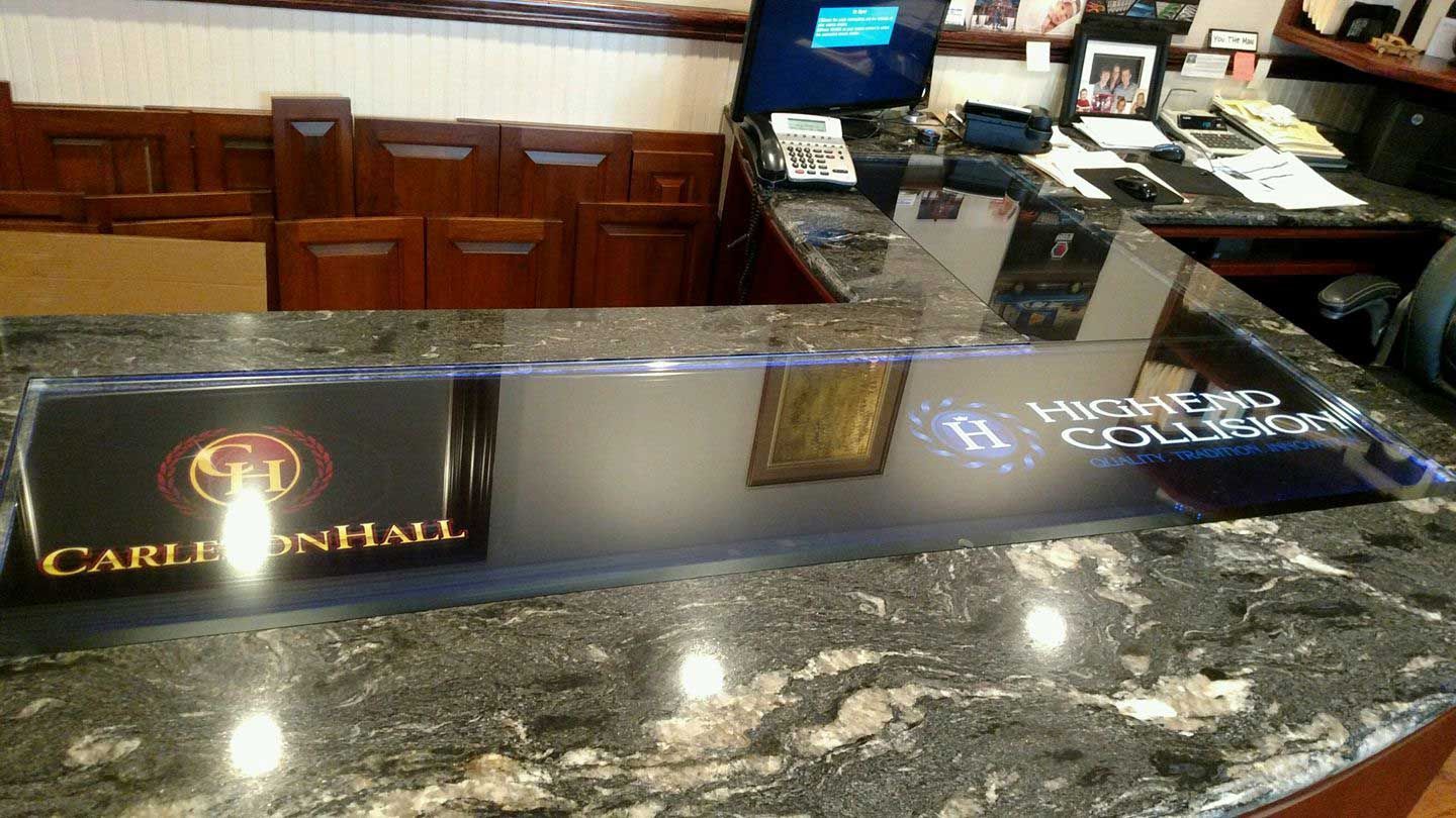 A carlton hall sign is sitting on a counter