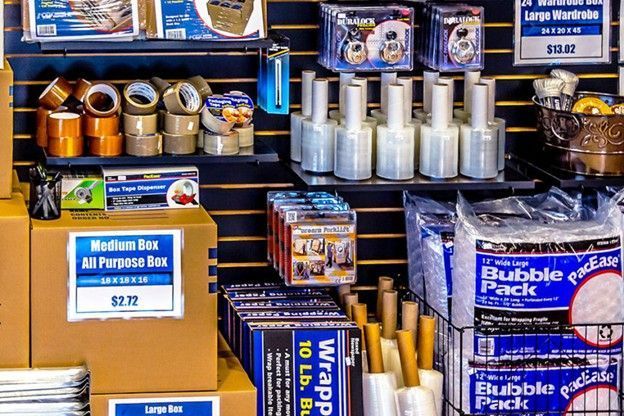 Display of assorted plastic wrap, foil, and food storage bags on store shelves