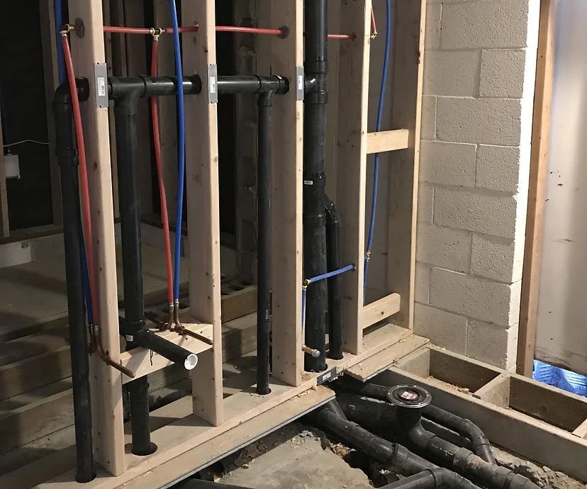 A room with a lot of pipes going through it