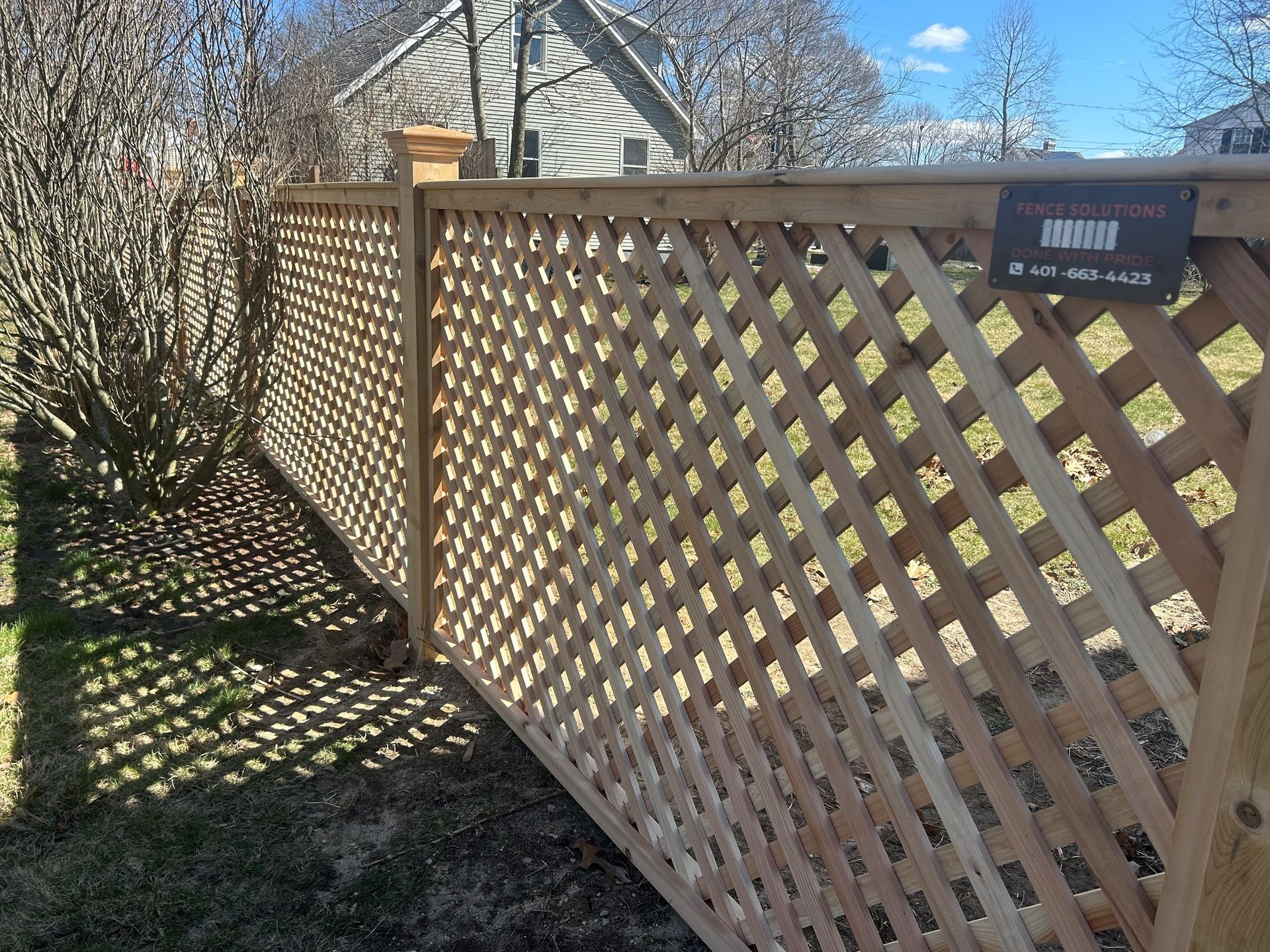 A wooden fence with a sign that says ' smith ' on it