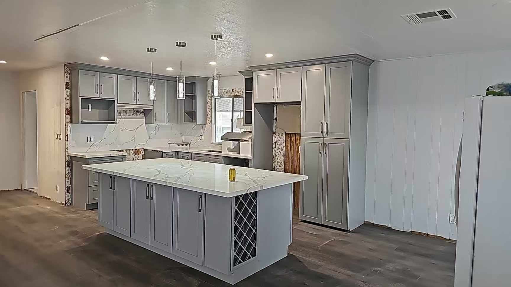 There is a large island in the middle of the kitchen.