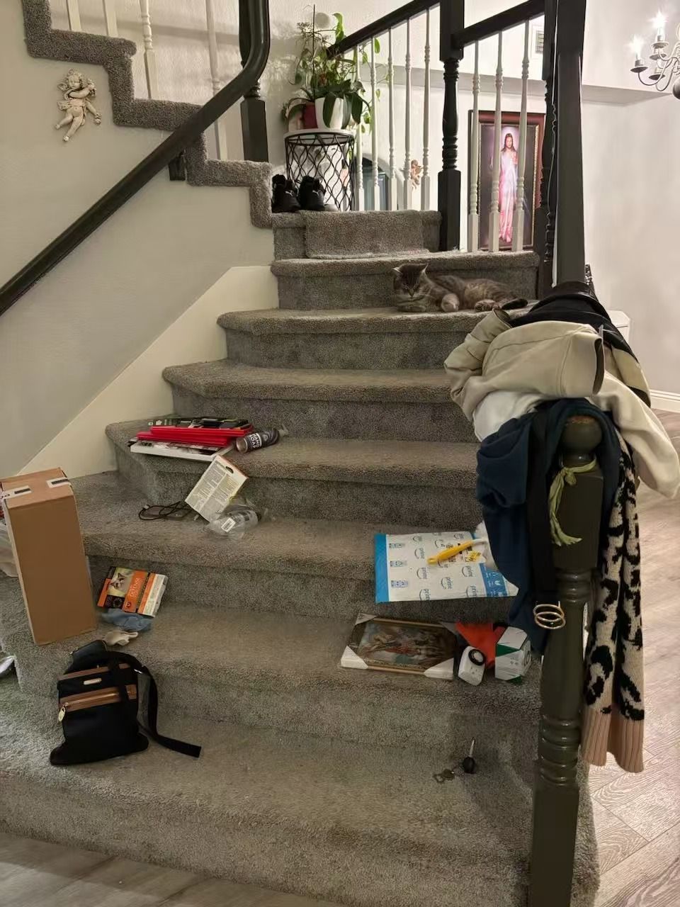 A staircase with a lot of clothes on the steps
