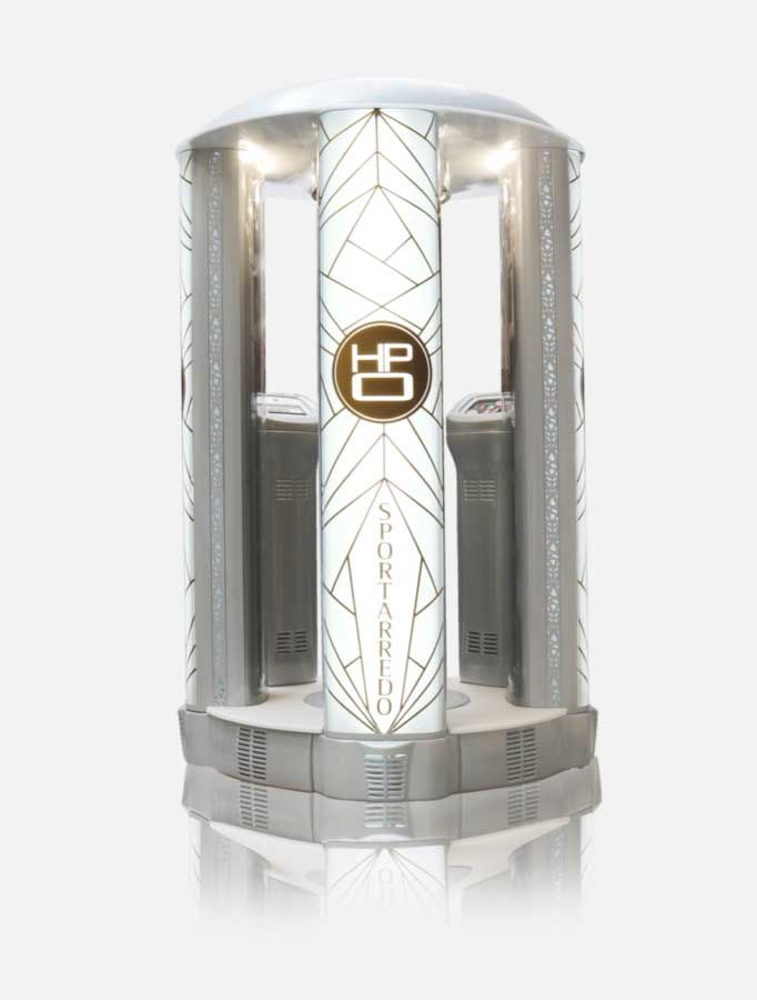 A silver spray tanning booth, with decorative geometric patterns and the words
