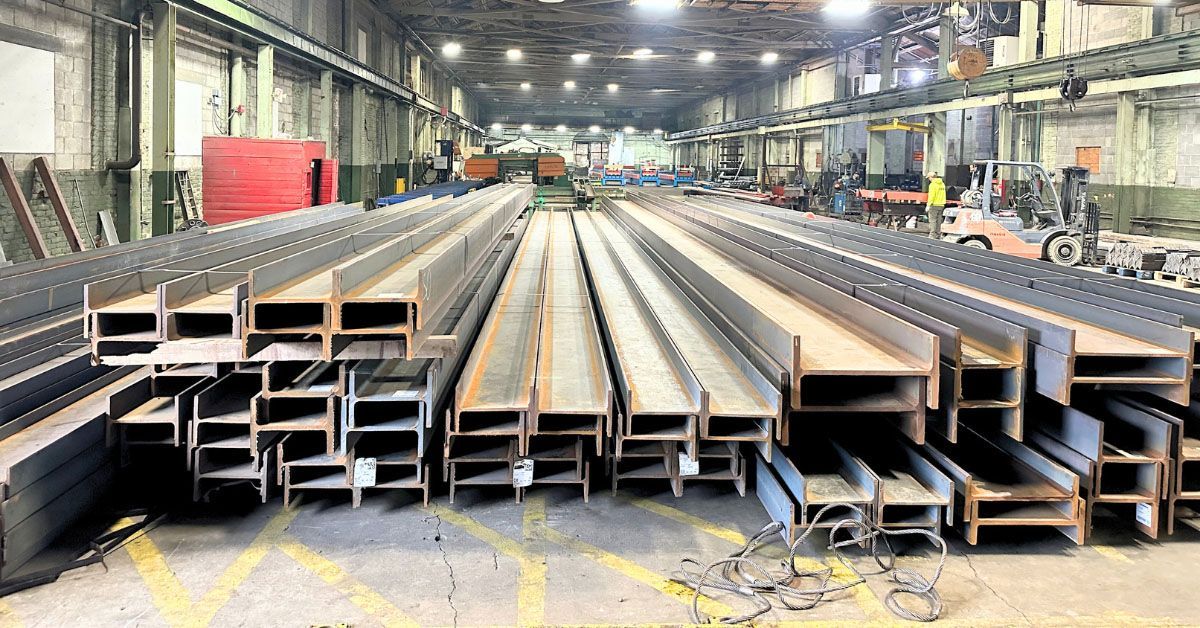 A large warehouse filled with lots of steel beams