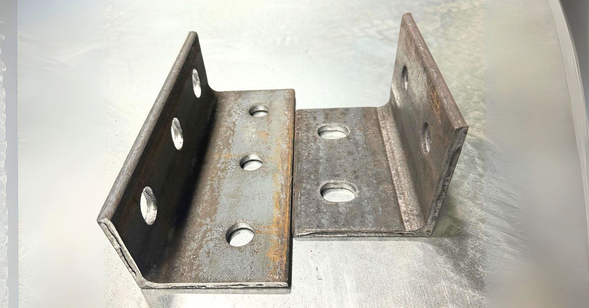 Two metal clips with holes in them