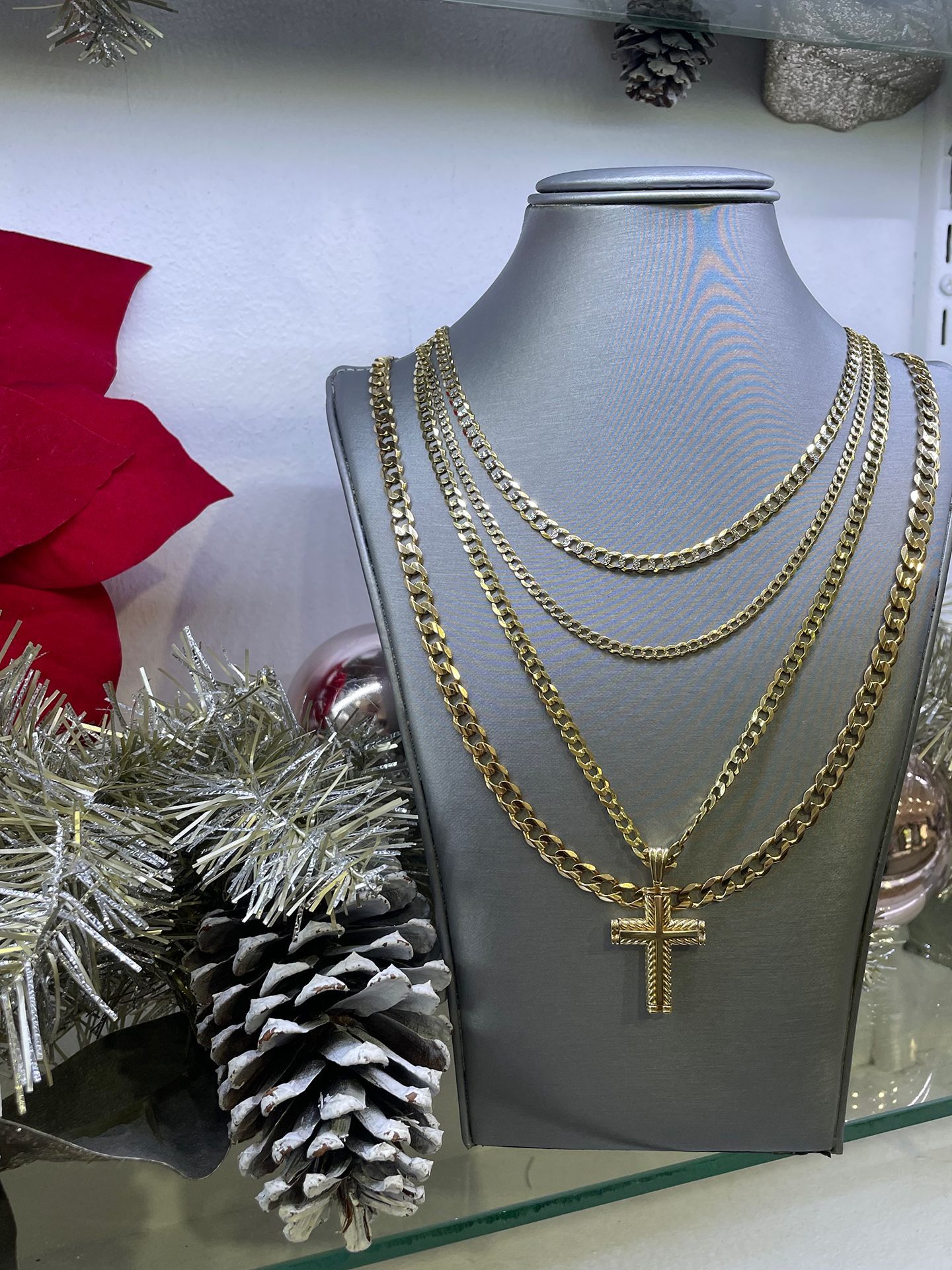 Gold necklaces with a cross pendant