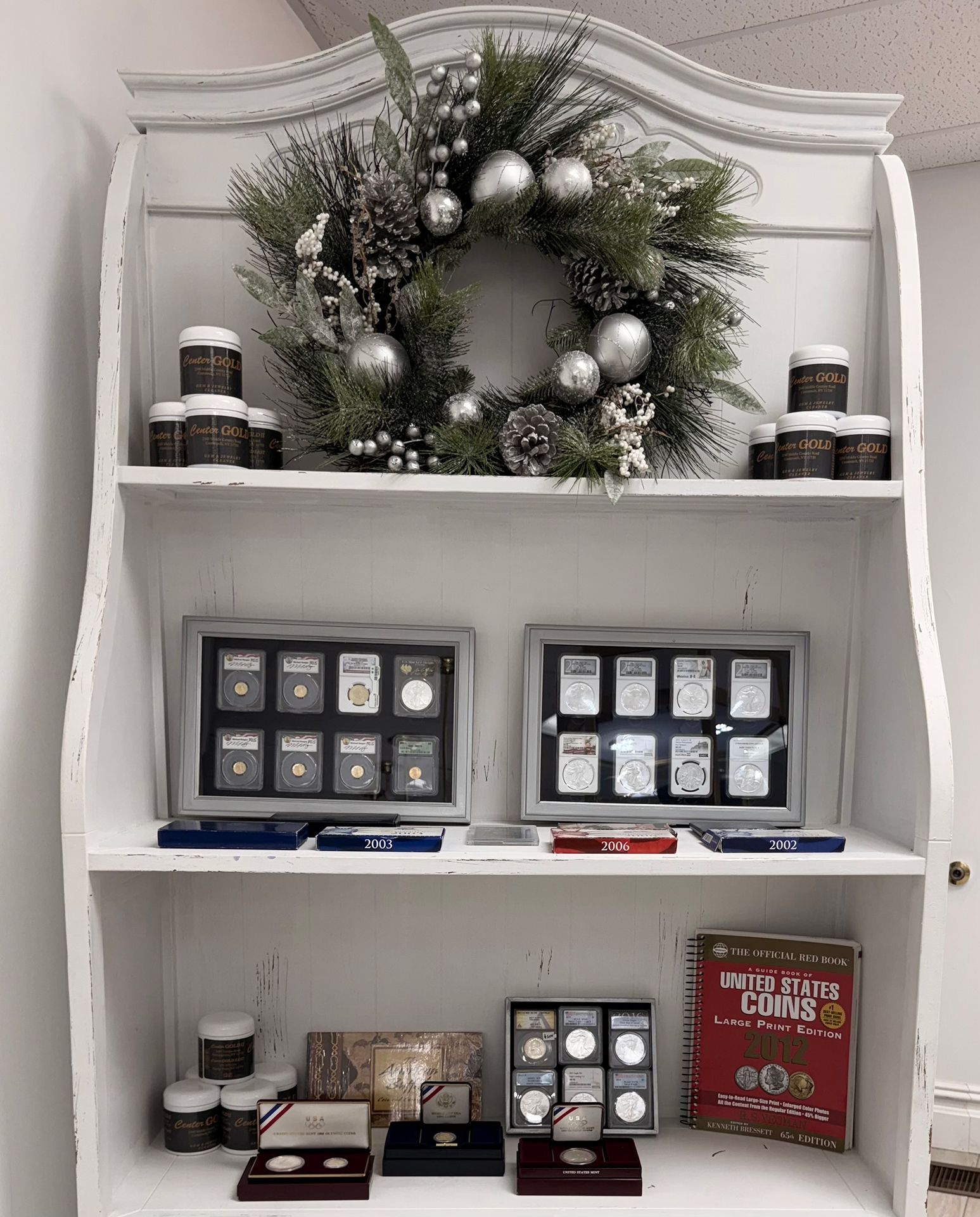 Display shelf with silver coins