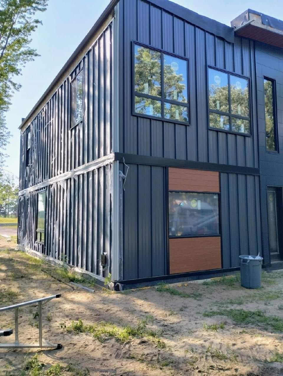 A large building with a lot of windows is being built.